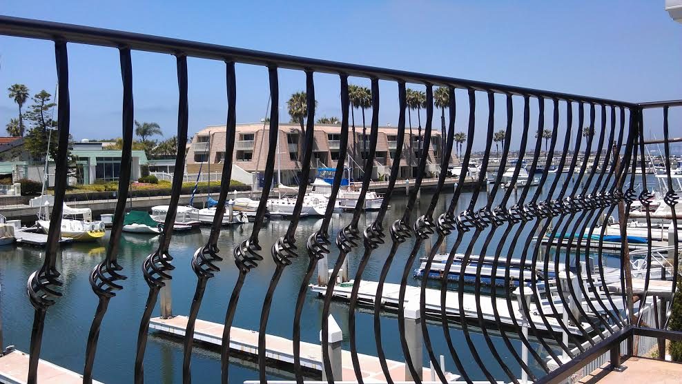 Iron railing along a waterfront walkway