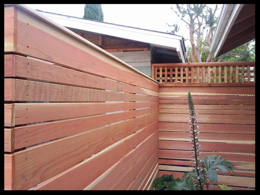 Stained wood fence showing a finished protective coating